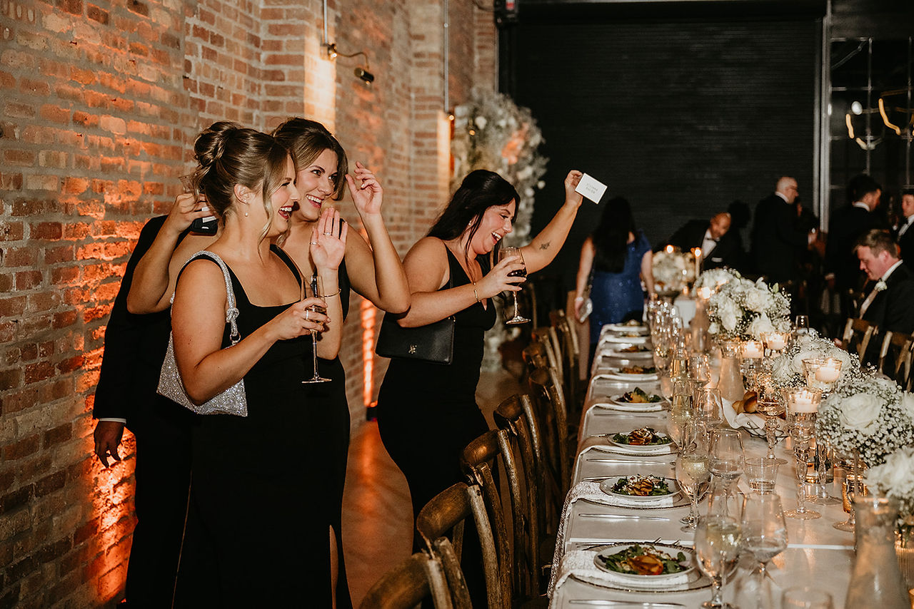 Bridal party surrounds sophisticated head table at upscale Chicago reception.
