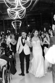 Bride and groom are welcomed by guests as newlyweds.