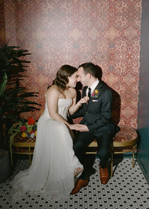 Bride and groom share intimate moment in Wildman BT bathroom.