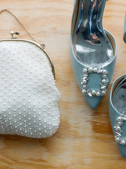Blue bridal shoes and beaded white purse.