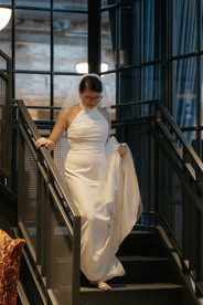 Bride walking down staircase before ceremony at Wildman BT Chicago wedding venue.