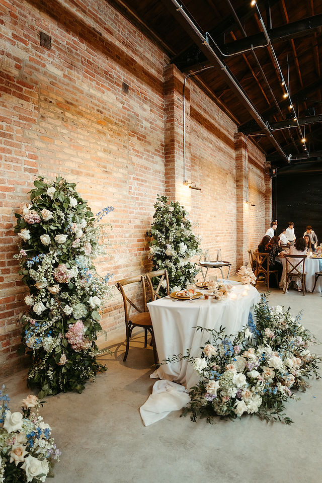 Styled by Stephanie pastel floral installations in airy loft.
