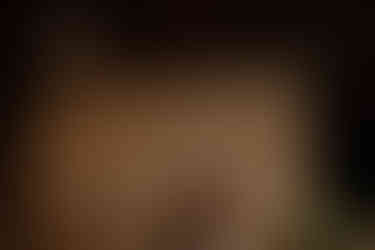 Bride and groom share first dance with media wall backdrop displaying their last name and Chicago skyline.