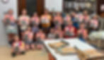 group of kids showing off their canvas painting during kids classes at the prairie arts center in north platte nebraska