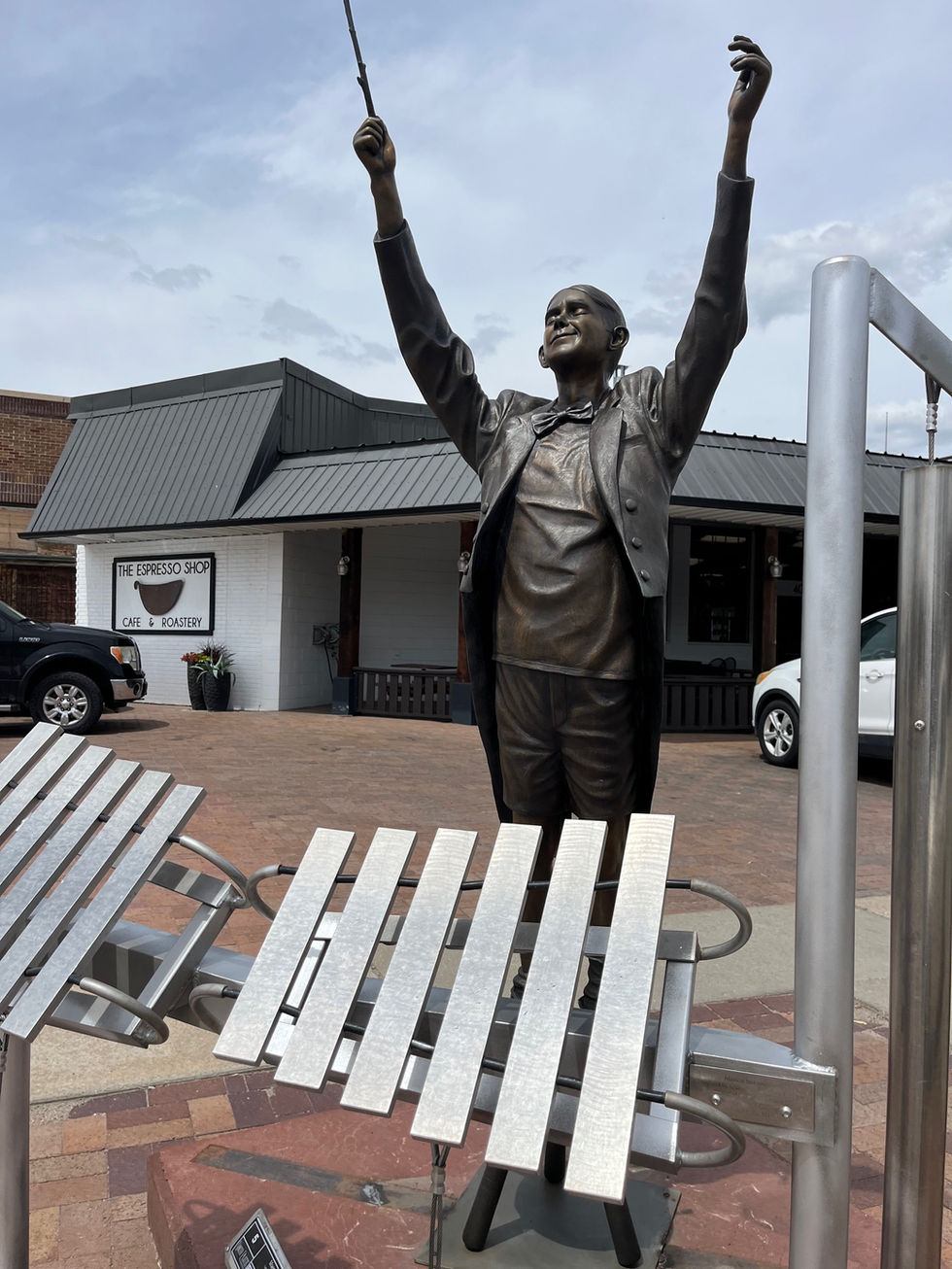 maestro outdoor sculpture by lee leuning and sherri treeby on the north platte sculpture walk located by the espresso shop in downtown north platte sponsored by the prairie arts center