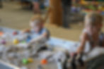 kids playing in sand at the stem station building at the lincoln county fairgrounds in north platte nebraska