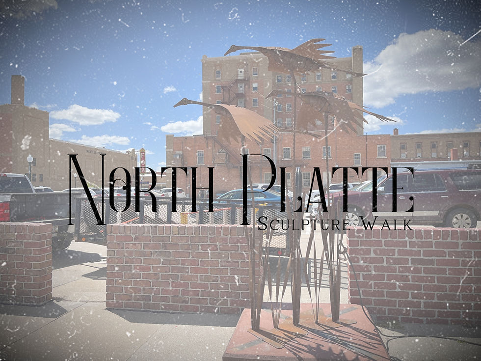 The vertical drift sculpture by jim and ryan pedersen on display at the Prairie Arts Center in North Platte Nebraska