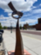 The in praise of resilience sculpture by paul reimer on display at the Prairie Arts Center in North Platte Nebraska