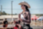 rodeo queen on a horse at a rodeo event
