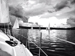 Sailboats in the harbour with storm approaching.