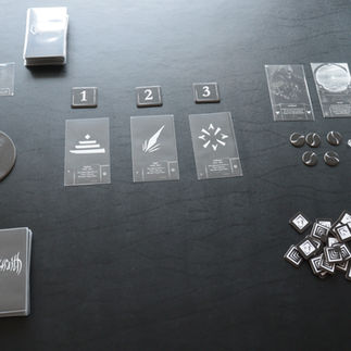 A black table with a game of Veilwraith upon it at the beginning set up phase.