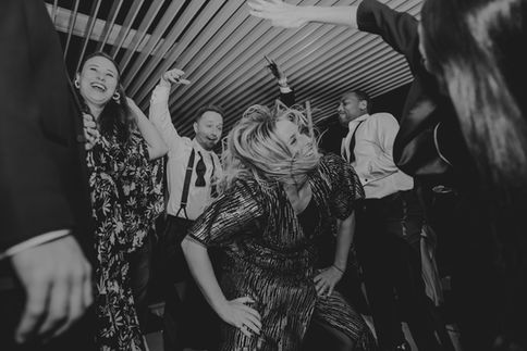 Wedding guests celebrating on the dance floor at a Houston venue by D&Co Entertainment