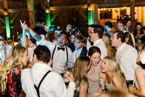 Wedding guests celebrating on the dance floor at a Houston venue by D&Co Entertainment