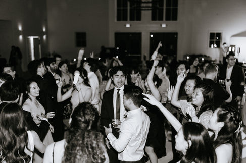 Wedding guests celebrating on the dance floor at a Houston venue by D&Co Entertainment