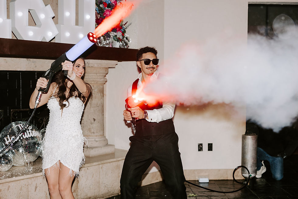 Bride and groom using CO2 cannons on dance floor at Bell Tower Houston