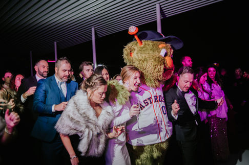 Bride and groom sharing a moment at a Houston wedding reception by D&Co Entertainment