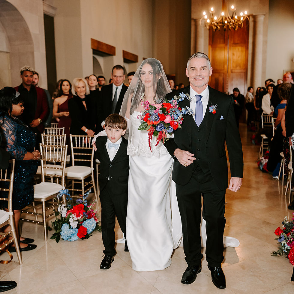 Bride walking down the aisle in The Candela at Bell Tower on 34th Houston