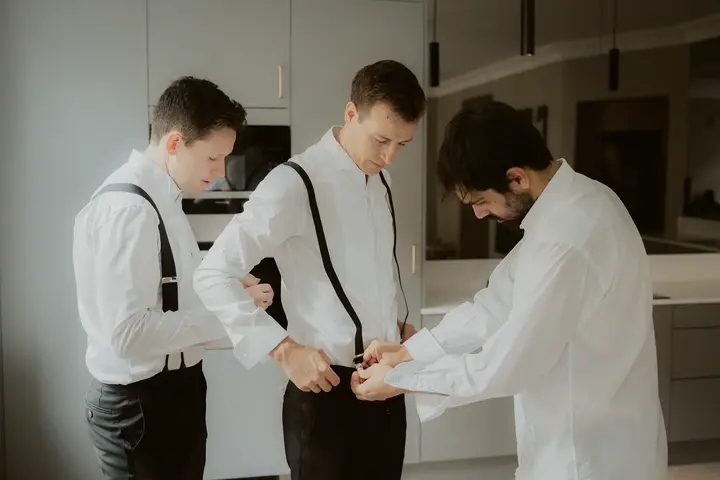 Groom getting ready for destination wedding in Norway