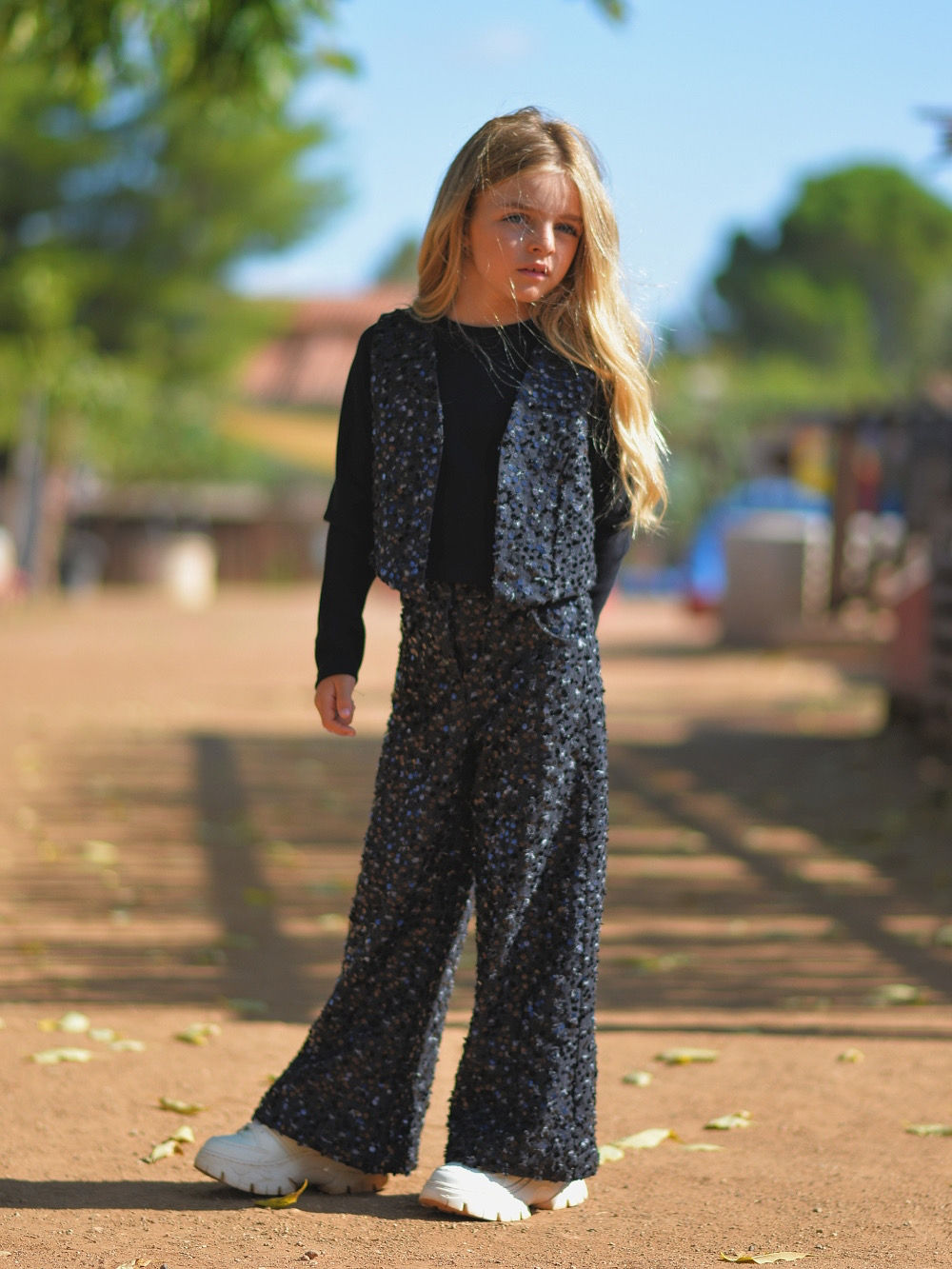Shiny sequined black denim vest
