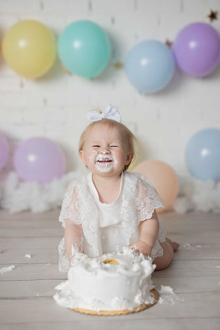 baby eating cake