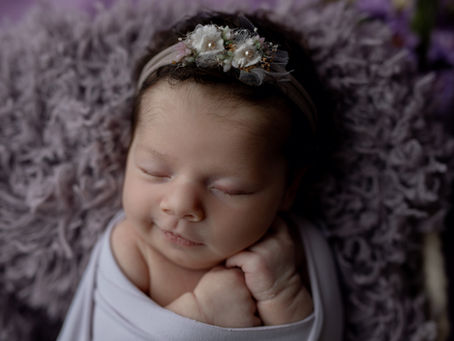 a baby sleeping during her newborn photography session