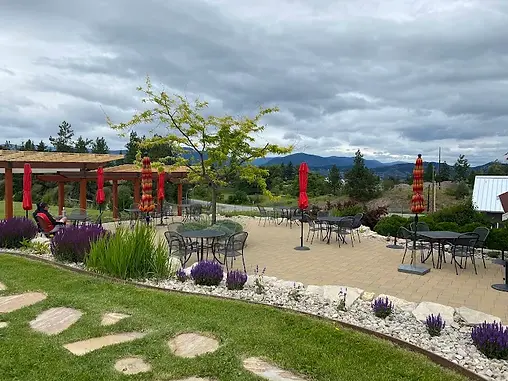 Spearhead Winery outdoor patio and picnic lawn surrounded by estate Pinot Noir vineyards in East Kelowna BC
