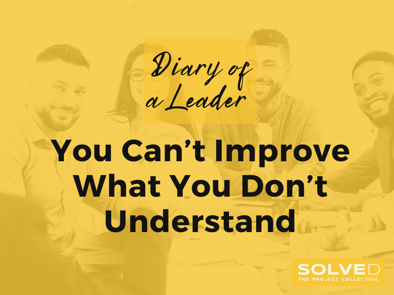 Leader listening to team members during a process discussion — illustrating curiosity and partnership in operational design.