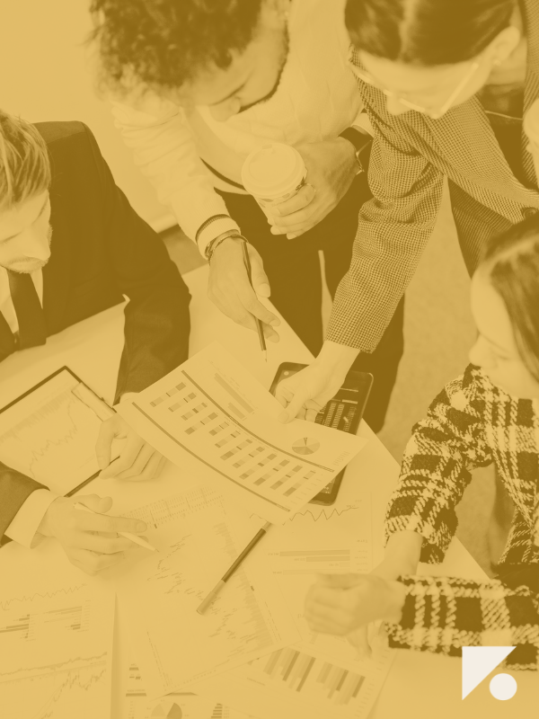 Leadership team reviewing output data to understand the link between productivity and business growth