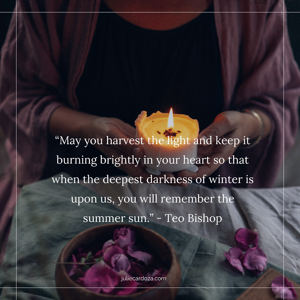 Woman holding a candle over a table with rose petals