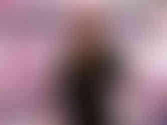 Woman shopping for packaged beef at a refrigerated supermarket meat case, illustrating U.S. consumer choices and retail meat market trends.