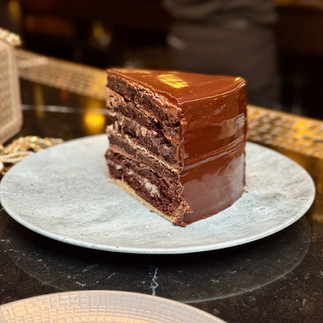 Signature chocolate cake served at Moody Tongue in Chicago, rich and layered, paired with craft beer