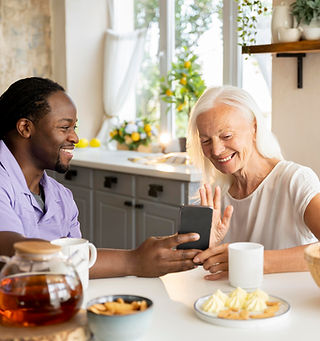 african-social-worker-helping-senior-woman.jpg