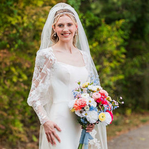bride smiling holding bouquet