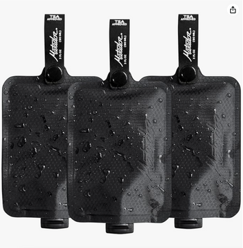 3 black toiletry bottles