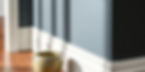 Premium luxury vinyl plank flooring with white baseboards.