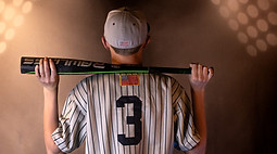Focused baseball athlete in action on the field