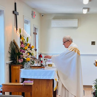 Fr. Chuck celebrating Eucharist.