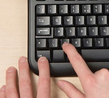 person-pressing-ctrl-z-on-pc-computer-ke