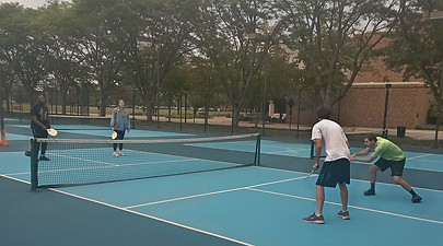 Deltasigs playing pickleball at Indiana State's tennis courts for a recruitment event.