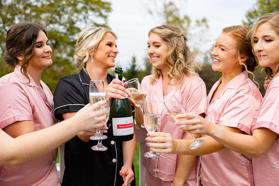 Graceful Beauty KC Bridal hair and makeup. Bridal party celebrating with champaign!
