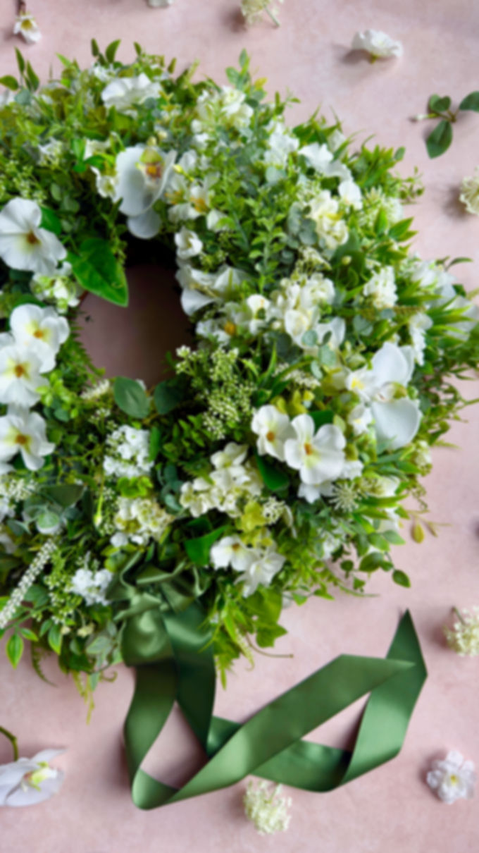 Luxury white summer wreath with orchids and wild greenery by Whispering Lily
