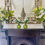 Thumbnail: artificial hellebores in resin water in green vase