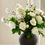 Thumbnail: soft white peony rose dogwood flowers arrangement in stylish black vase - whispering-lily