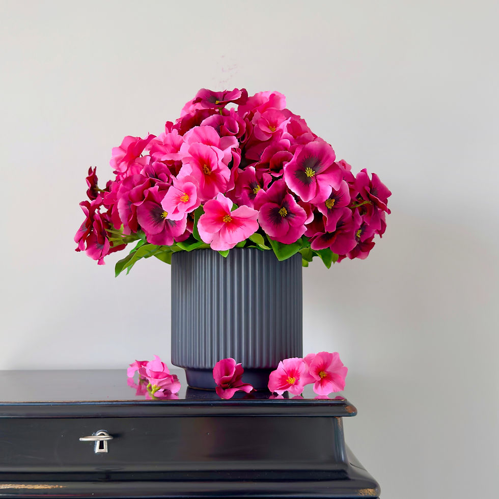 luxury magenta pansies in a black ceramic pot - whispering-lily