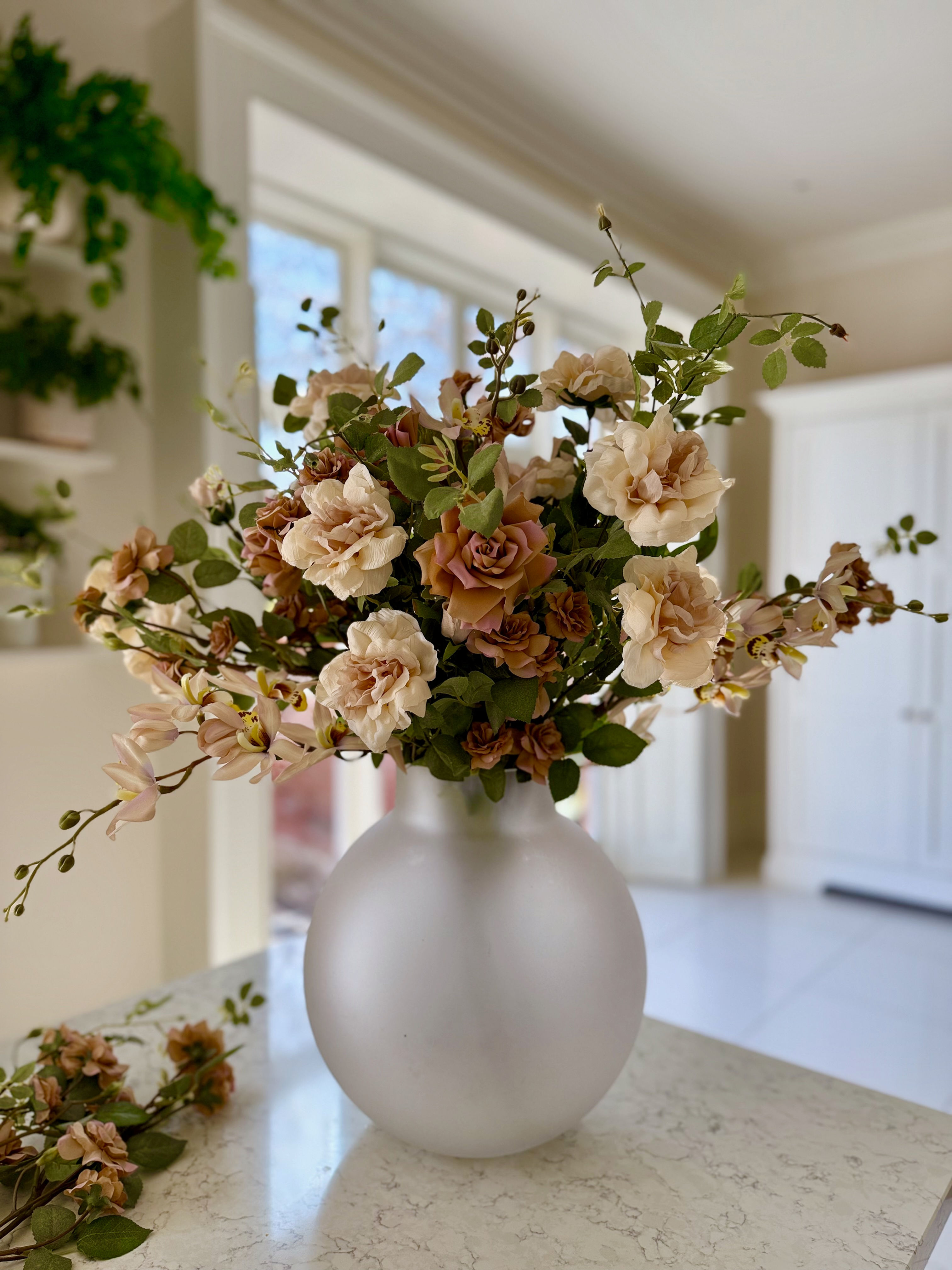 cream rose and orchid arrangement