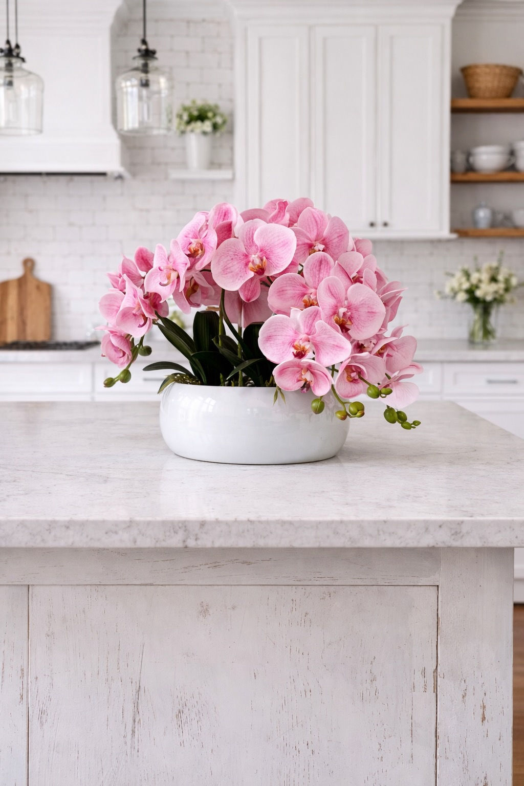 White ceramic flower bowl planter styled on kitchen island