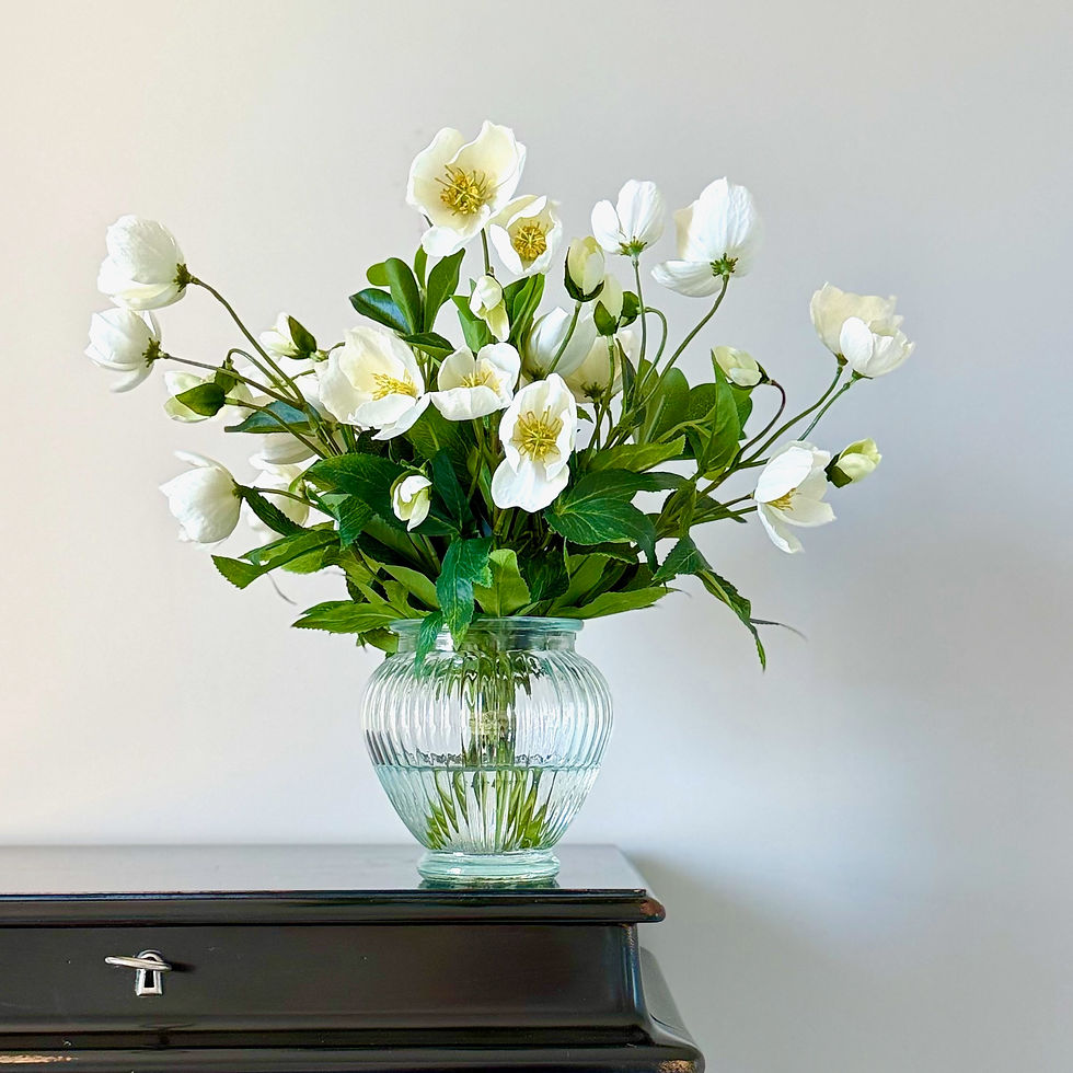 soft-white-hellebore-in-clear-ribbed-vase-in-faux-water-whispering-lily