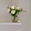 Thumbnail: artificial white roses and ranunculus in resin water in a glass vase