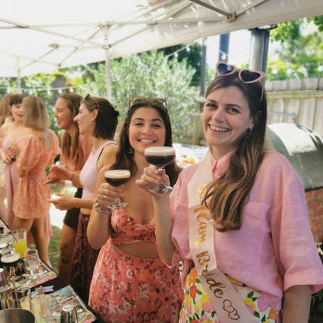 Hens party cocktail class with guests shaking cocktails in Melbourne, Sydney or Brisbane.