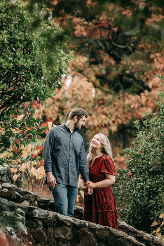 Jeremy and Shelby smiling during their fairytale engagement session in downtown Macon captured by a Macon Georgia engagement photographer